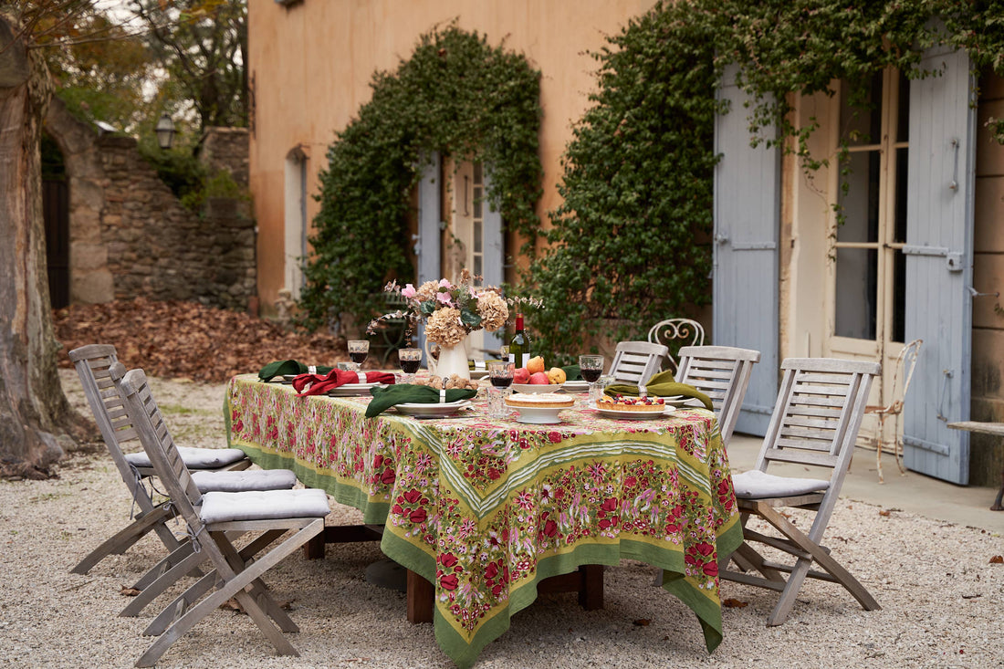 Jardin red and green French tablecloth styled on a table, hand block-printed cotton
