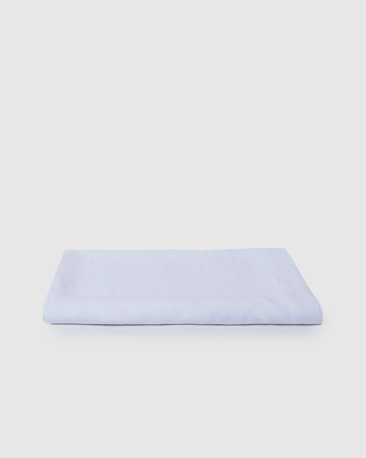 Milk white stonewashed French flax linen tablecloth on dining table