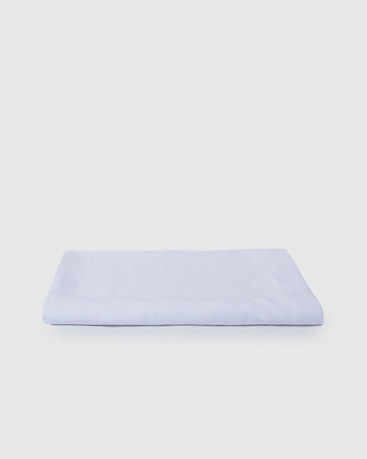 Milk white stonewashed French flax linen tablecloth on dining table