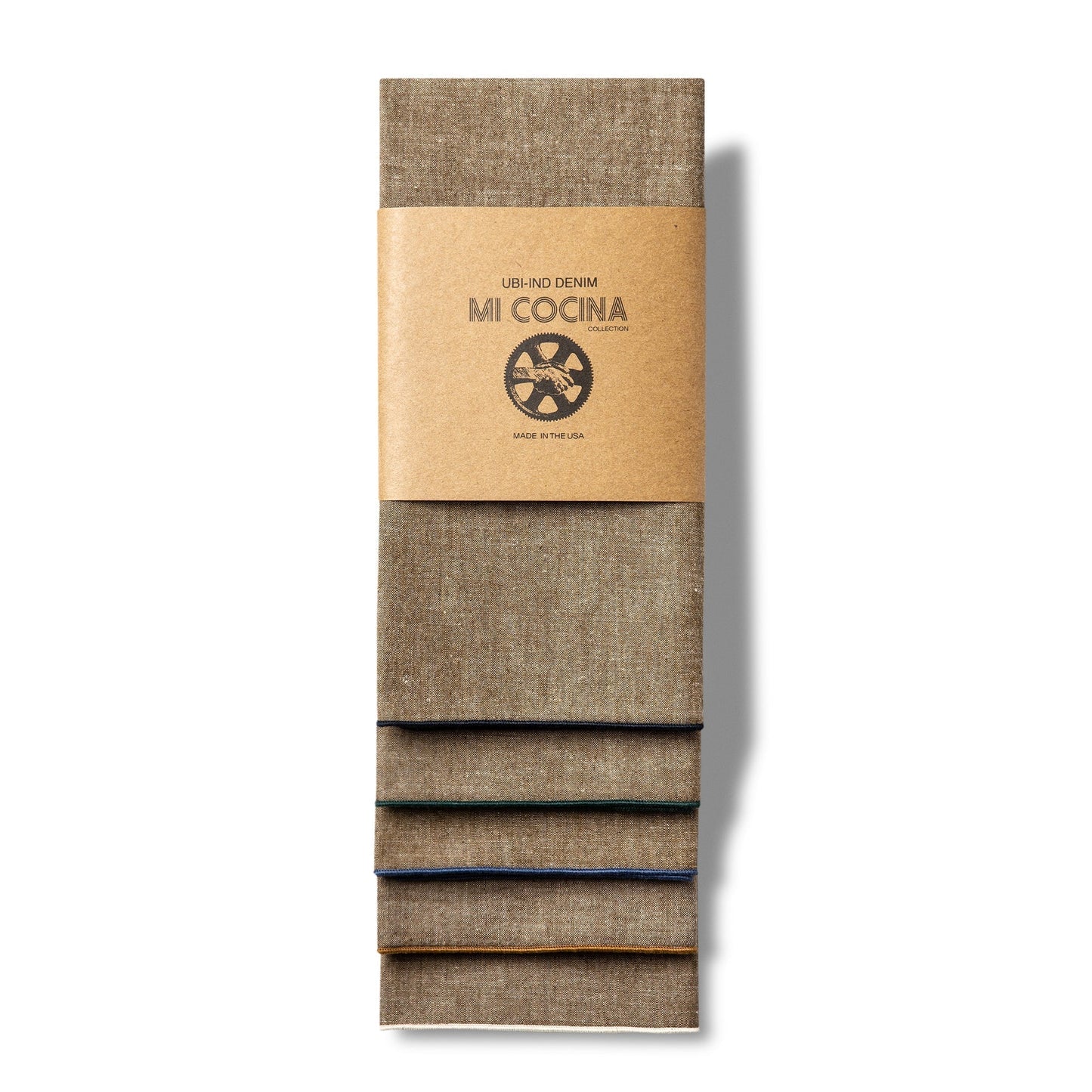 Tan chambray cotton napkin with heathered texture and contrast stitching